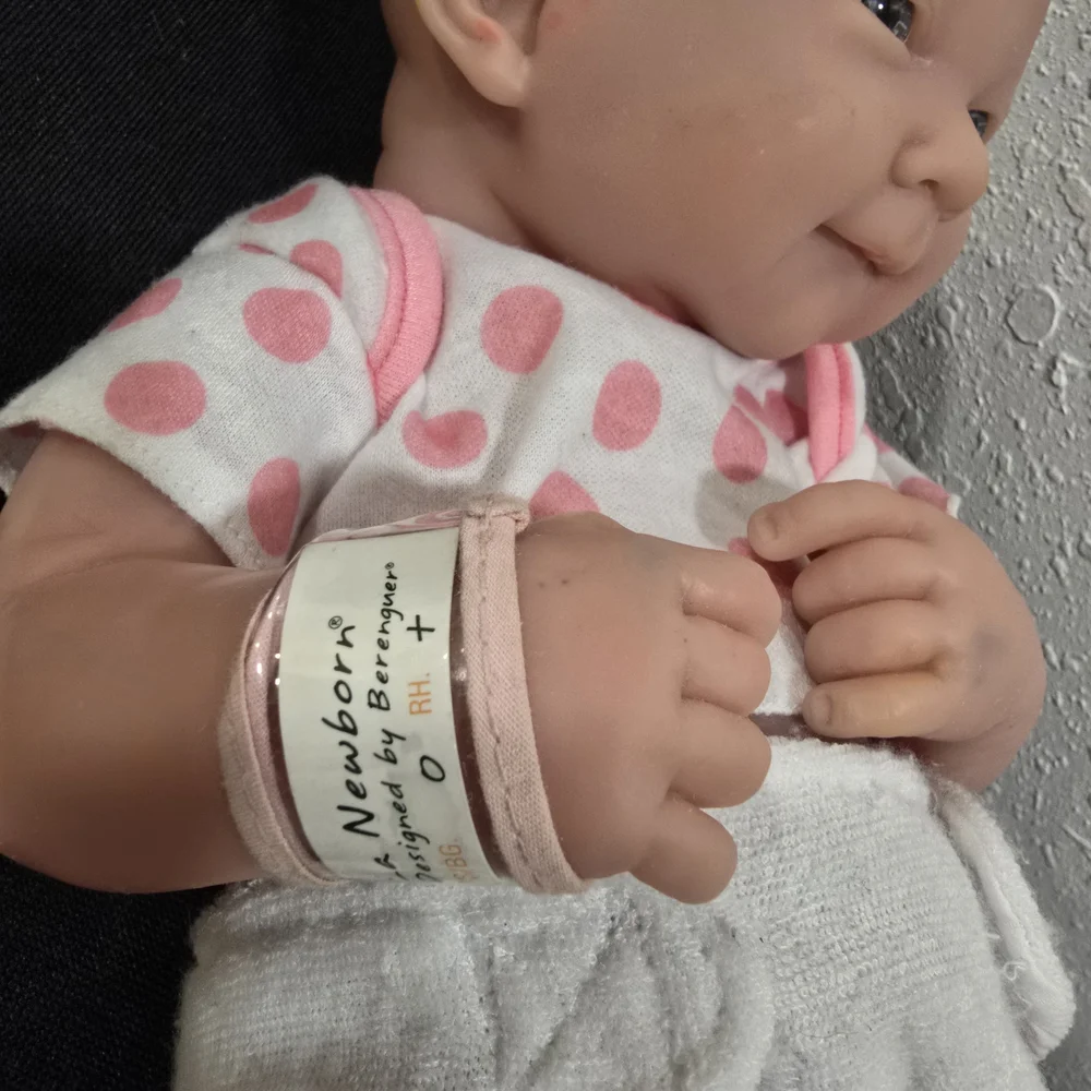 Adorable Baby Doll with Pink Polka Dot Outfit